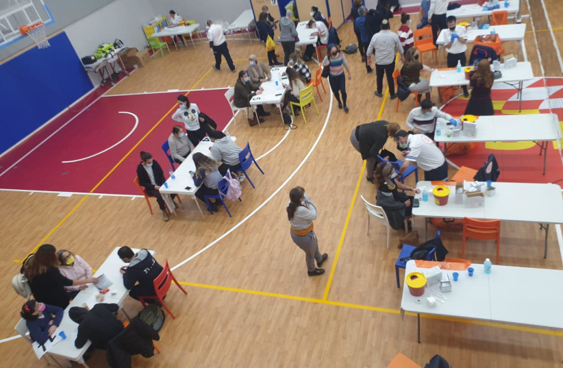 Thousands get vaccinated for COVID-19 within the Shalva National Center's sports complex. (photo credit: SHALVA)