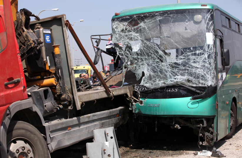 An accident between a truck and Egged public bus kills one person and injured 32 people, Tuesday morning when an Egged bus slammed into a tractor-trailer parked on the shoulder of Route 1 near Ben Shemen Junction (photo credit: YOSSI ZAMIR/FLASH90)