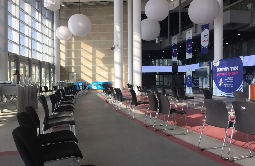 The empty Maccabi vaccination center at the Pais Arena in Jerusalem at 2:30 p.m. on January 5, 2020. (photo credit: HANNAH BROWN)