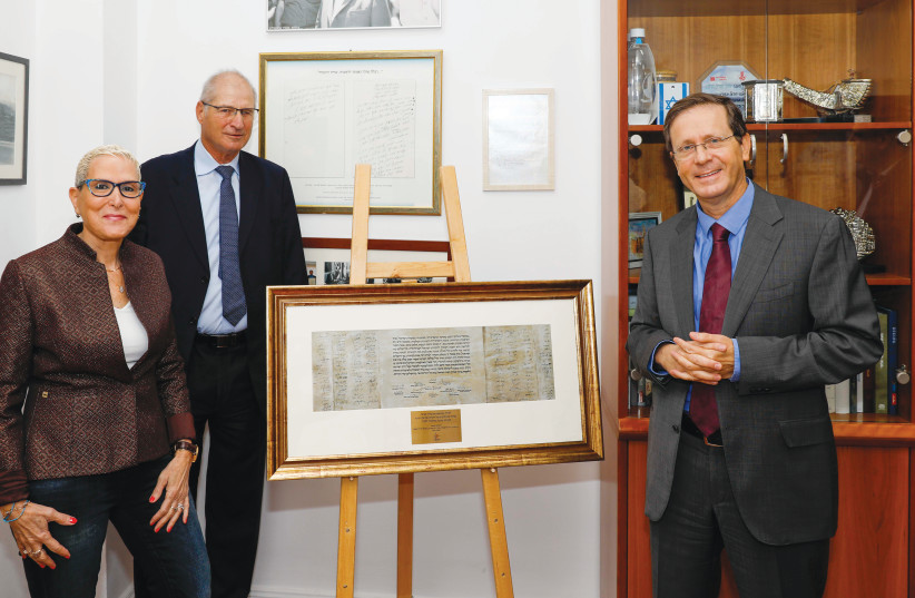 FROM LEFT: Mira Altman is presented with a gift from Jerusalem International Convention Center Chairman David Shimron and Jewish Agency Chairman Isaac Herzog upon her retirement from the JICC. (photo credit: GUY YEHIELI)