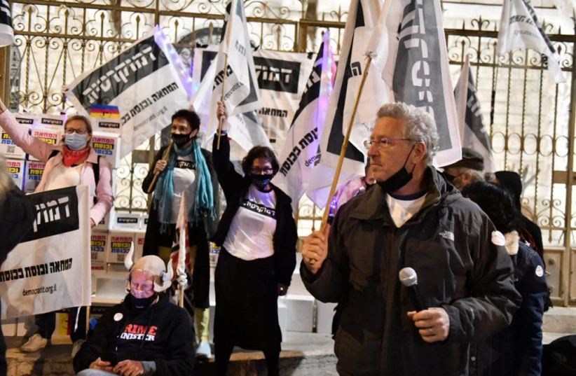Founder of the 'Democratic' party Prof. Ehud Shapiro announces the launch of the party during Saturday's protests against Prime Minister Benjamin Netanyahu at Balfour Street, Jerusalem on Saturday, January 9, 2020. (photo credit: DEMOCRATIC - LIBERTY EQUALITY AND SOLIDARITY)