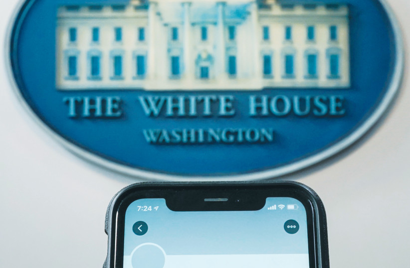 A PHOTO illustration shows the suspended Twitter account of US President Donald Trump on a smartphone at the White House briefing room in Washington last week. (photo credit: JOSHUA ROBERTS / REUTERS)