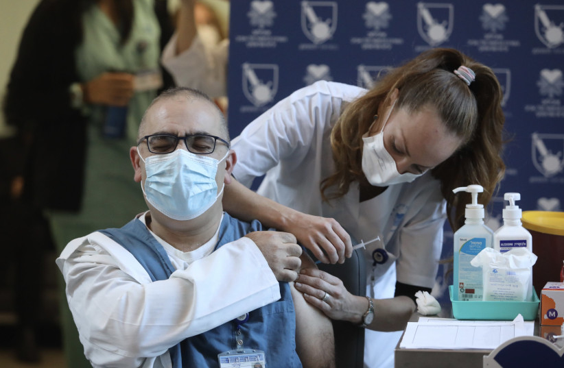 Getting vaccinated in Jerusalem (photo credit: MARC ISRAEL SELLEM)