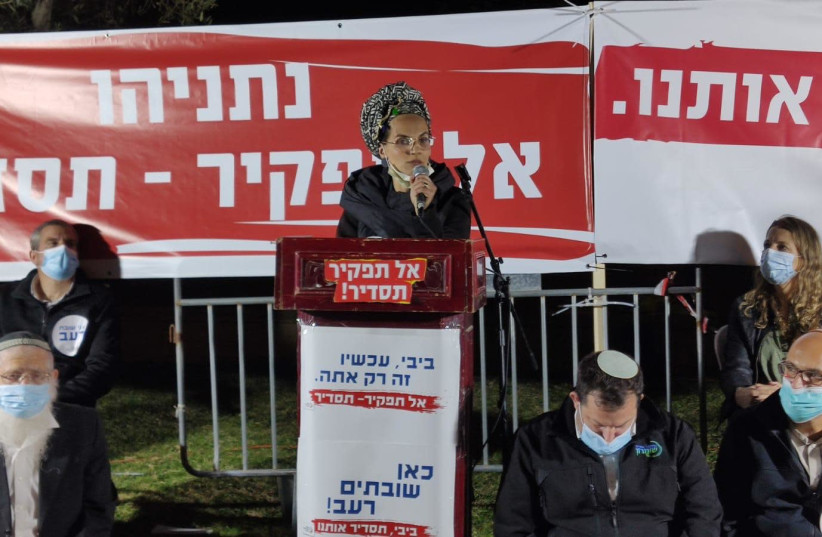 Yael Shevach is seen speaking at Tuesday night's outpost rally in Jerusalem.  (photo credit: YOUNG SETTLEMENTS FORUM)