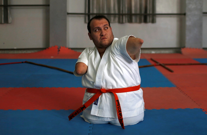 Gaza man with disabilities conquers karate (photo credit: REUTERS)