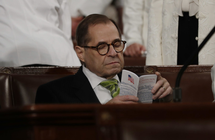 House impeachment manager and Judiciary Committee Chairman Jerry Nadler (D-NY) sits in his seat reading a pocket copy of the US Constitution as he waits for the start of US President Donald Trump's State of the Union address to a joint session of the US Congress in the House Chamber of the US Capito (photo credit: REUTERS/LEAH MILLIS/POOL)