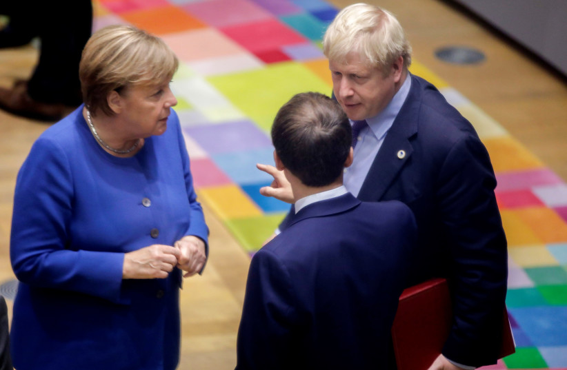 British Prime Minister Boris Johnson, German Chancellor Angela Merkel and French President Emmanuel Macron attend a round table meeting at the European Union leaders summit, in Brussels, Belgium October 17, 2019 (photo credit: REUTERS)