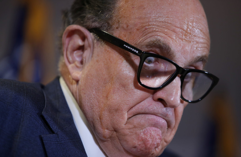 Former New York City Mayor Rudy Giuliani, personal attorney to US President Donald Trump, speaks during a news conference about the 2020 U.S. presidential election results held at Republican National Committee headquarters in Washington, US, November 19, 2020. (credit: REUTERS/JONATHAN ERNST)