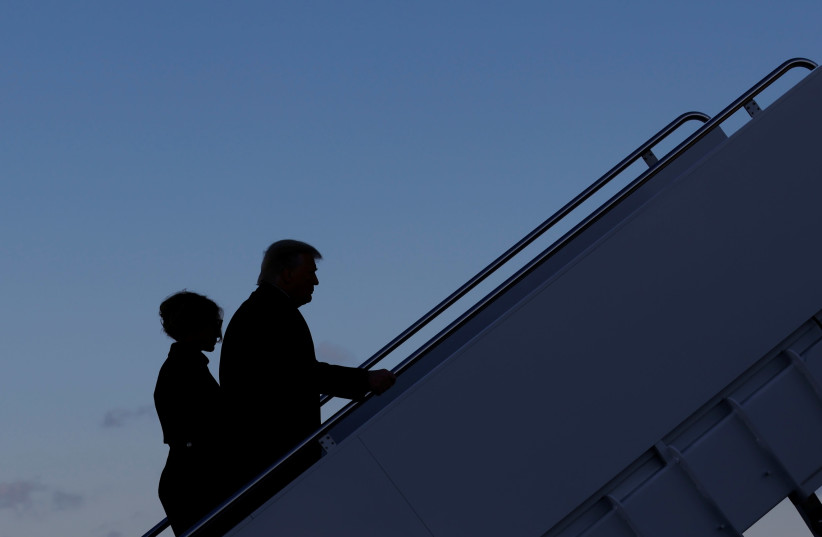 US President Donald Trump departs next to first lady Melania Trump from the Joint Base Andrews, Maryland, US, January 20, 2021. (photo credit: CARLOS BARRIA / REUTERS)