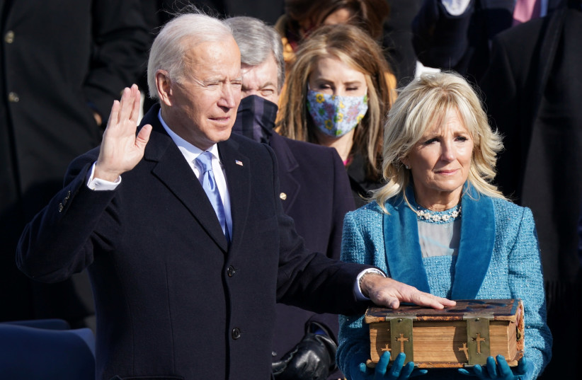 Joe Biden is sworn in as the 46th President of the United States on the West Front of the US Capitol in Washington, US, January 20, 2021. (photo credit: REUTERS/KEVIN LAMARQUE)