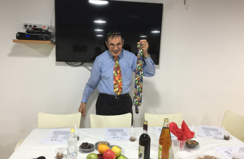 Prof. Richard Schwartz preparing to lead a Tu Bishvat Seder in 2018. (photo credit: Courtesy)