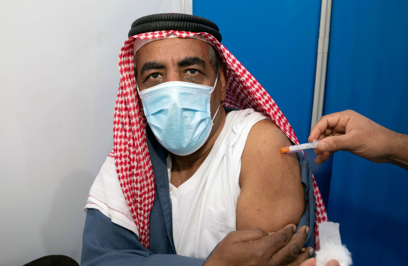 GETTING VACCINATED in Kuwait City in late December. (photo credit: REUTERS/STEPHANIE MCGEHEE)