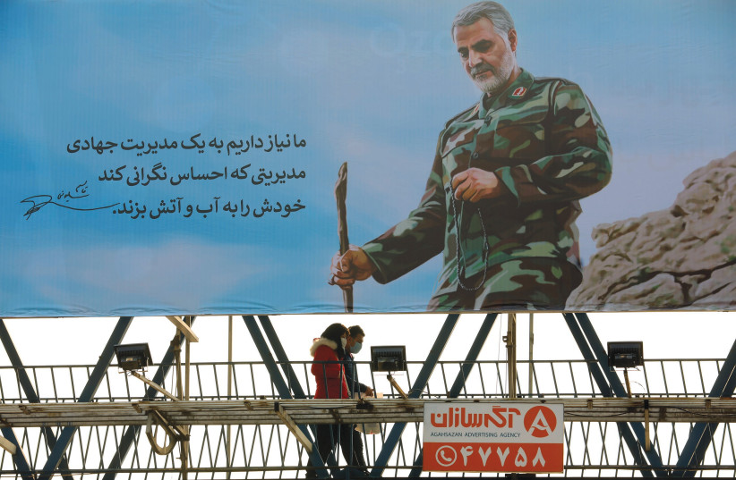 THE IRANIAN people have more pressing issues at hand than the regime’s clumsy attempts at propaganda. Pictured: A poster showing senior Iranian military commander Gen. Qasem Soleimani during the one-year anniversary of his killing in a US attack, in Tehran last month.  (photo credit: MAJID ASGARIPOUR/WANA (WEST ASIA NEWS AGENCY) VIA REUTERS)