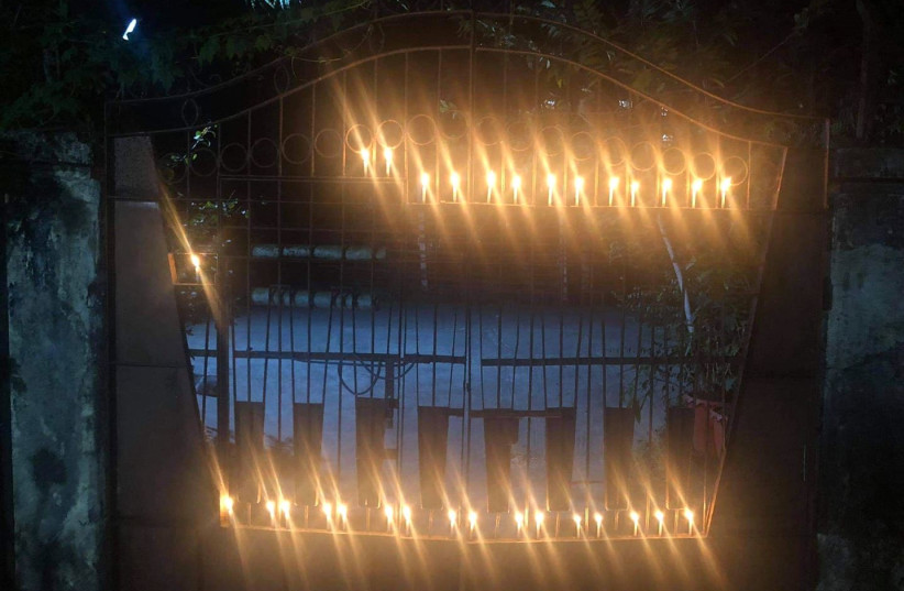 Residents of Yangon light candles outside their houses to show their disapproval of the recent military coup in Myanmar, Feb. 2, 2021. (photo credit: MON MON MYAT)