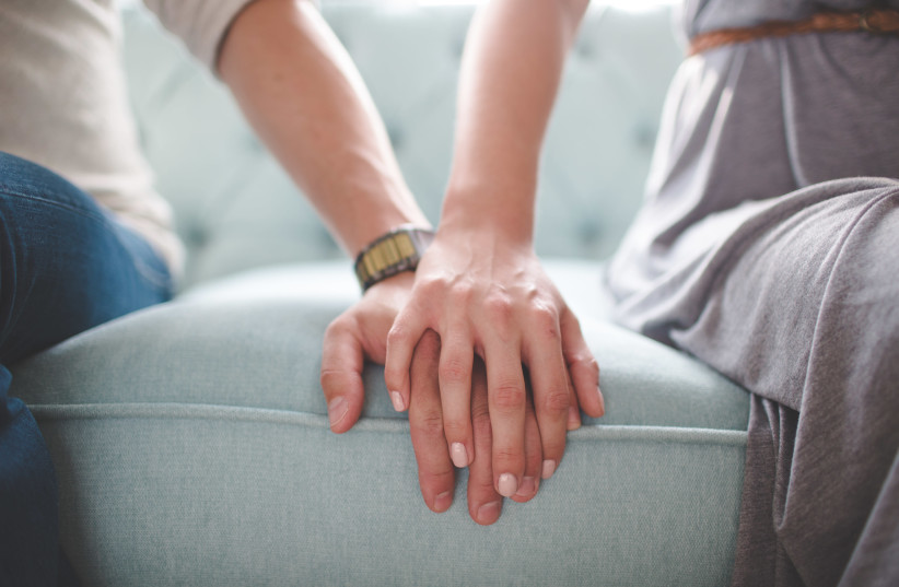 Couple touching their hand (photo credit: GETTY IMAGES)