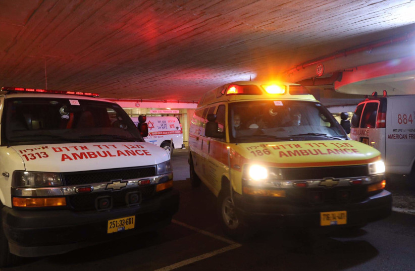 Ambulances are seen at Tel Aviv's Sourasky Medical Center (Ichilov) amid the coronavirus pandemic, on February 4, 2021. (photo credit: MARC ISRAEL SELLEM/THE JERUSALEM POST)