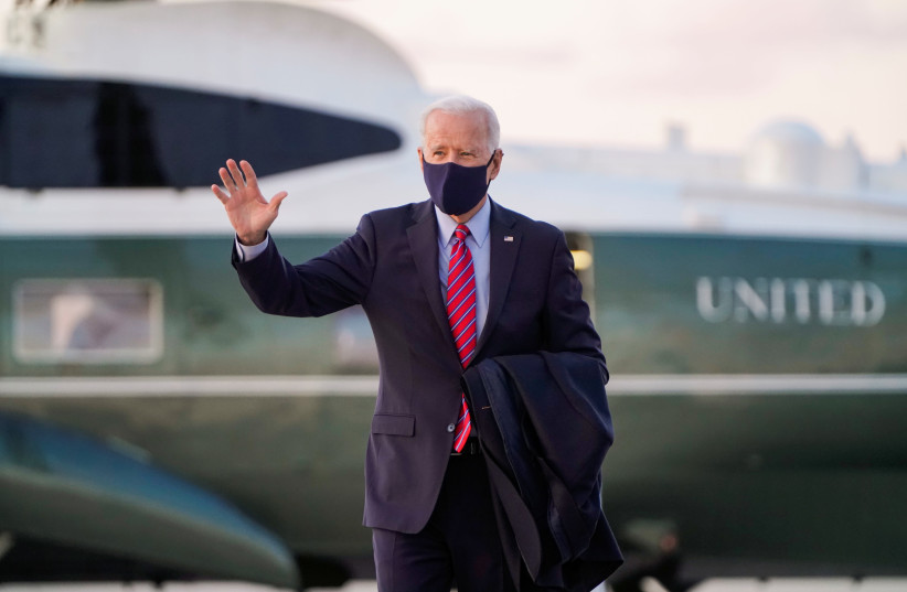 US President Joe Biden stands in front of Air Force One. (photo credit: REUTERS/JOSHUA ROBERTS)