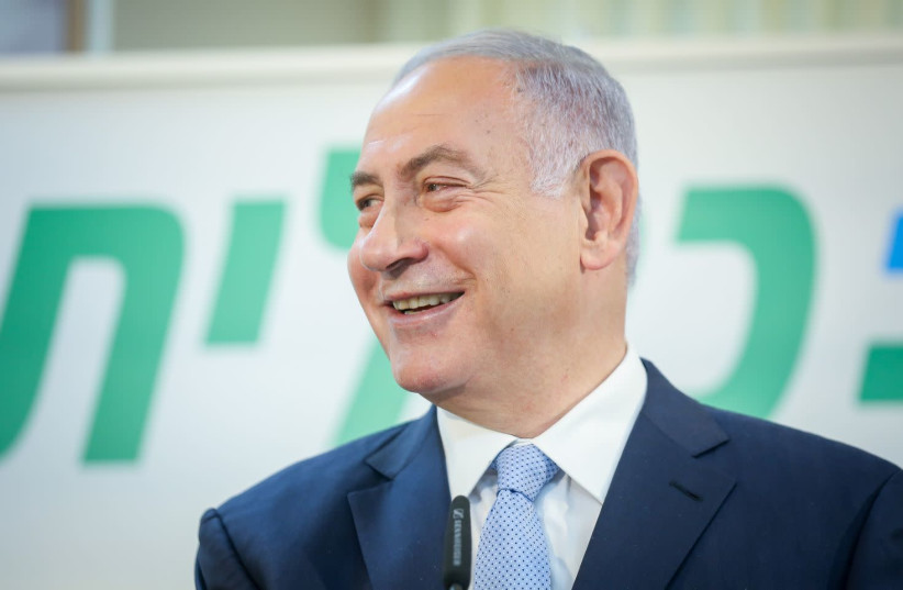 Prime Minister Benjamin Netanyahu is seen speaking at a Clalit vaccination center in Zarzir, on February 9, 2021. (photo credit: DAVID COHEN/FLASH 90)