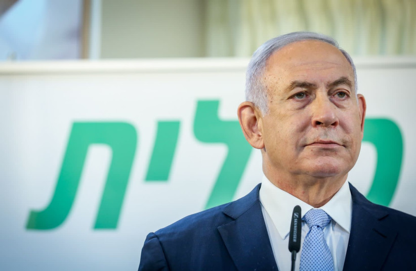 Prime Minister Benjamin Netanyahu is seen speaking at a Clalit vaccination center in Zarzir, on February 9, 2021. (photo credit: DAVID COHEN/FLASH 90)