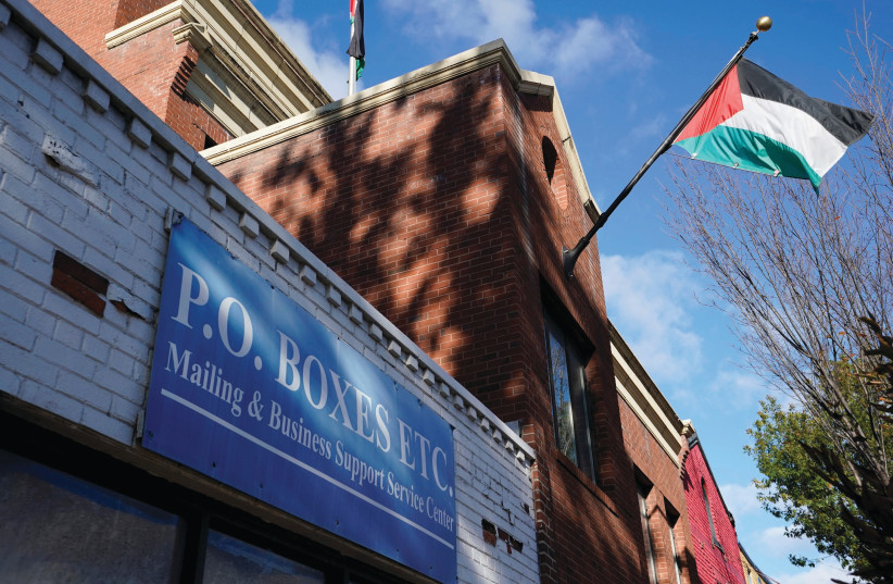 THE PALESTINIAN flag flies at the PLO office in Washington. (photo credit: YURI GRIPAS/REUTERS)