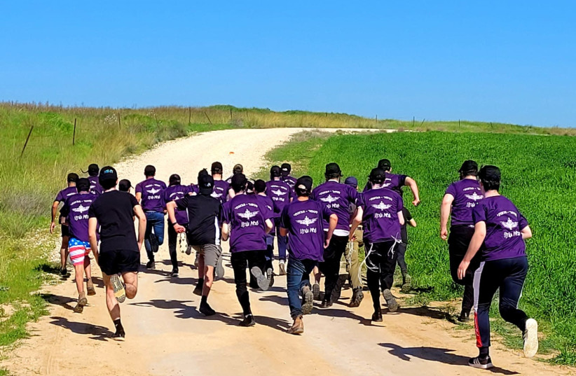 Ultra-orthodox IDF recruits wearing purple, the color of Hadar Goldin's unit Givati. (photo credit: Courtesy)