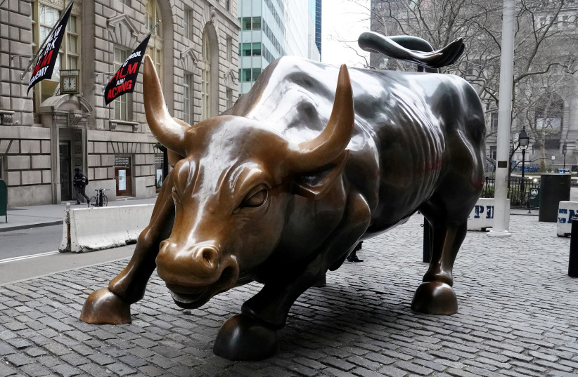 The Charging Bull or Wall Street Bull is pictured in the Manhattan borough of New York City. (photo credit: CARLO ALLEGRI/REUTERS)
