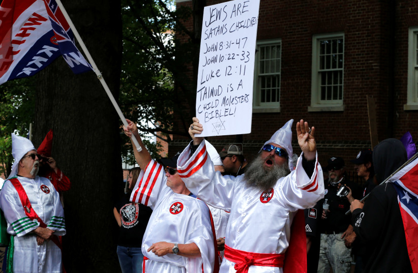 Members of the Ku Klux Klan rally in support of Confederate monuments in Charlottesville, Virginia, US, July 8, 2017 (photo credit: REUTERS/JONATHAN ERNST)