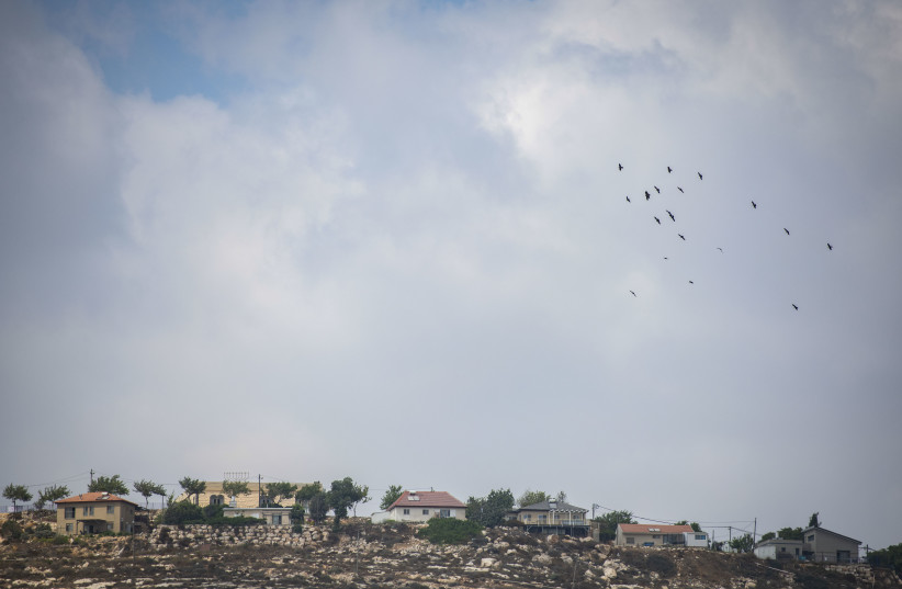 Israeli border police officers stand guard near the Yitzhar setllment where illegal structures were demolished earlier in the morning on August 12, 2020. (photo credit: SRAYA DIAMANT/FLASH90)