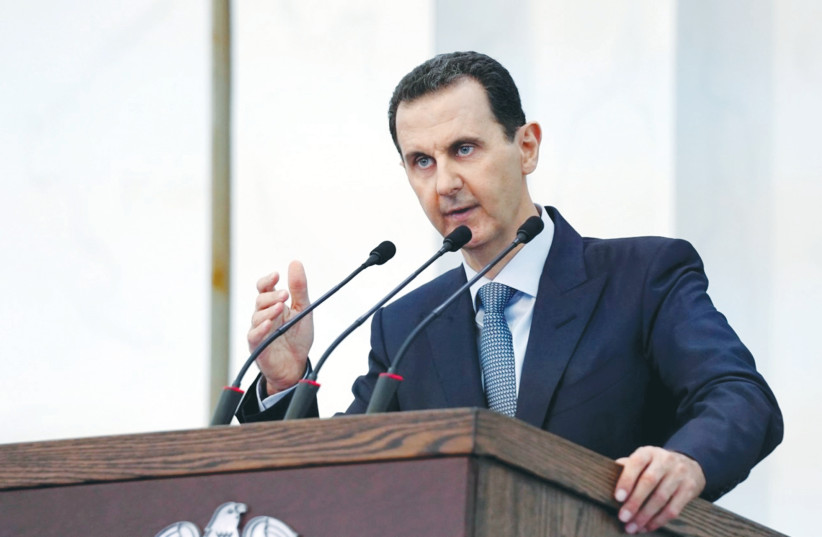 SYRIAN PRESIDENT Bashar Assad addresses members of his country’s parliament in Damascus in August.  (photo credit: SANA/REUTERS)