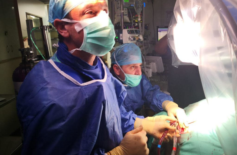 The transplant operation being performed at Bellinson Medical Center.   (photo credit: Courtesy)