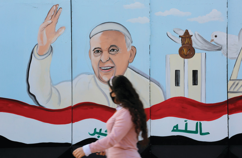 A MURAL of Pope Francis adorns a church wall ahead of his upcoming visit to Iraq, in Baghdad on February 22. (photo credit: TEBA SADIQ/FILE PHOTO/REUTERS)