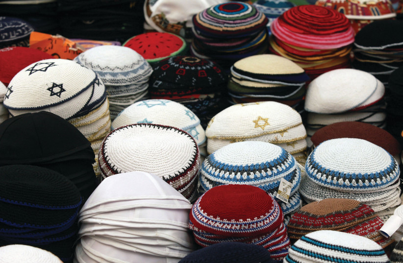 A VARIETY of kippot are displayed for sale at a stall in Jerusalem’s Mahaneh Yehuda market. (photo credit: MARC ISRAEL SELLEM/THE JERUSALEM POST)