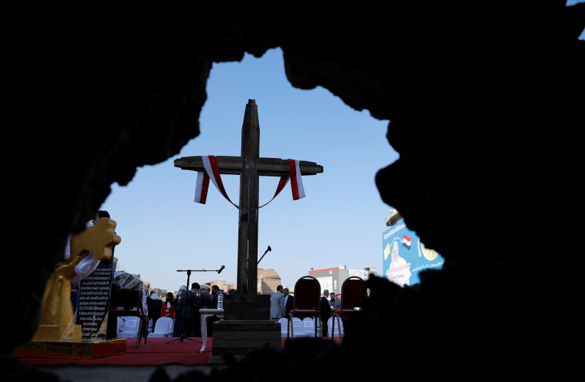 A wooden cross is seen at the site where Pope Francis will hold a mass at 'Hosh al-Bieaa', Church Square, in Mosul's Old City, Iraq, March 7, 2021.  (photo credit: REUTERS/ABDULLAH RASHID)