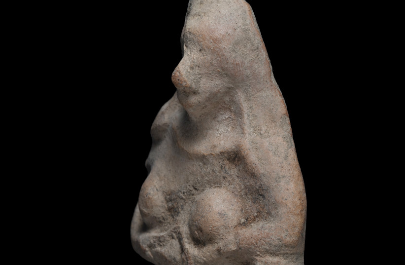 Female figuirine, probably a fertility amulet, discovered in the Negev Desert (photo credit: YEVGENY OSTROVSKY/ISRAEL ANTIQUITIES AUTHORITY.)
