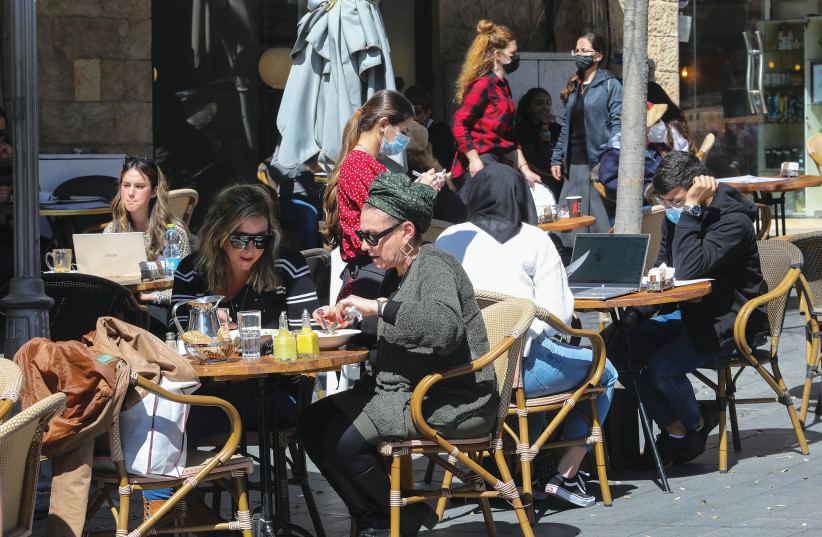 DINERS TAKE to reopened cafés with a vengeance in Jerusalem. (photo credit: MARC ISRAEL SELLEM/THE JERUSALEM POST)
