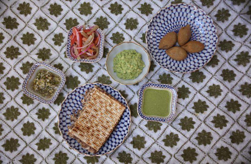 Alegra Smeke's Passover table includes a matzah meat pie; guacamole; chile güero encurtido, a mix of slices of carrots, tomatoes and red onions with olive oil, salt and lemon; and kibbeh, balls of meat mixed with toasted pine nuts and rice. (photo credit: ELVIRA SMEKE)