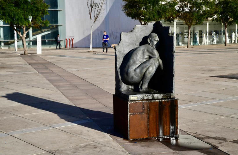 A statue portraying Prime Minister Benjamin Netanyahu squatting and seemingly relieving himself was erected in Tel Aviv's Kikar HaBima, March 17, 2021. (photo credit: AVSHALOM SASSONI/MAARIV)
