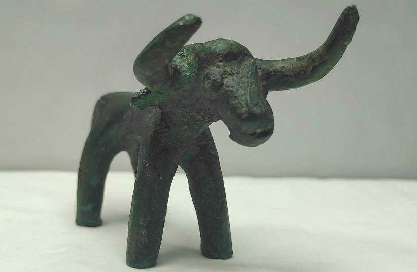 Bronze bull idol unearthed at the archaeological site of Olympia (photo credit: GREEK MINISTRY OF CULTURE/HANDOUT VIA REUTERS)