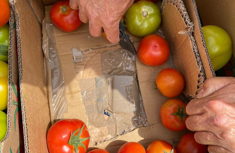 Israeli border security thwart an attempted smuggling of gold at the bottom of tomato crates from Gaza to the Palestinian Authority, March 22, 2021.  (credit: BORDER AUTHORITY AND DEFENSE MINISTRY)