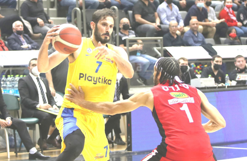 OMRI CASSPI (left) and Maccabi Tel Aviv were to strong for host Hapoel Haifa, powering their way to a 37-point 104-67 triumph in Israel Winner League action (photo credit: LILACH WEISS)