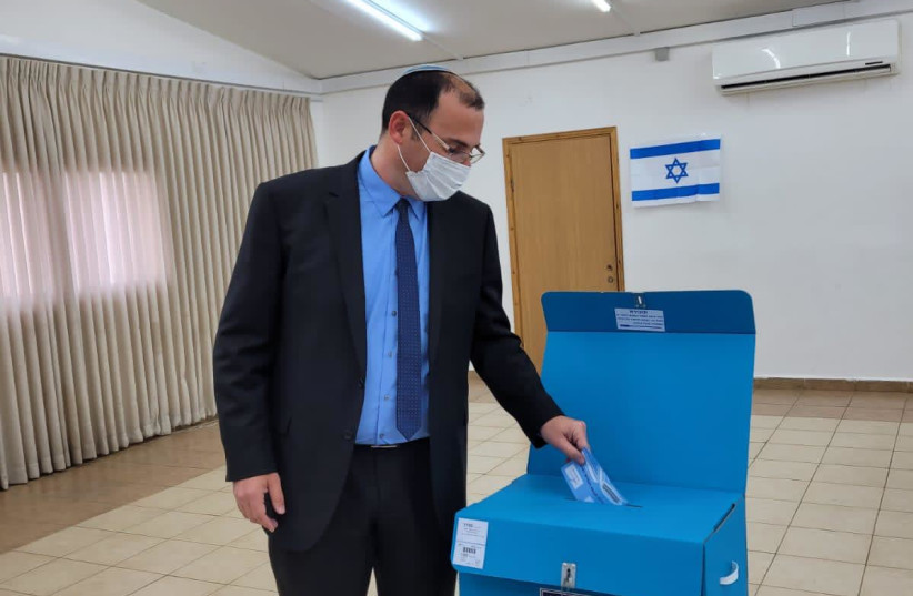  Religous Zionist Party candidate Simcha Rothman voted in  Metzad. '''Go out and vote. Do not be complacent.'' (credit: Courtesy)