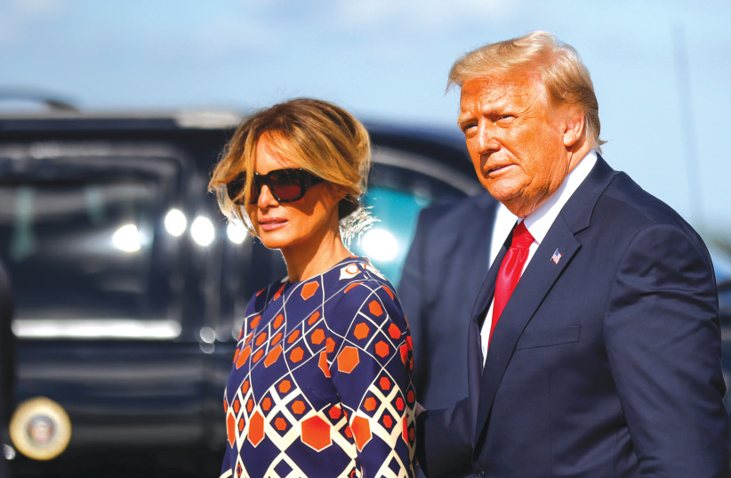 DONALD TRUMP and Melania Trump arrive at Palm Beach International Airport in Florida, after leaving the White House for the last time in January. (photo credit: CARLOS BARRIA / REUTERS)