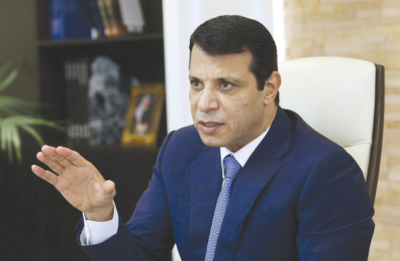 MOHAMMAD DAHLAN gestures in his office in Abu Dhabi, in 2016. Why is Abbas so afraid of him, who was once seen as his trusted ally and close confidant? (photo credit: REUTERS)