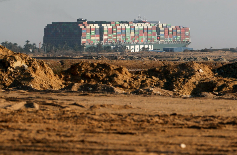 Stranded container ship Ever Given, one of the world's largest container ships, is seen after it ran aground, in Suez Canal, Egypt March 26, 2021. (photo credit: MOHAMED ABD EL GHANY/REUTERS)