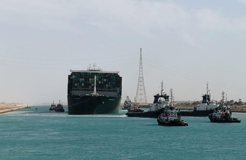 Ship Ever Given, one of the world's largest container ships, is seen after it was fully floated in Suez Canal, Egypt March 29, 2021 (photo credit: SUEZ CANAL AUTHORITY/HANDOUT/AFP VIA GETTY IMAGES))