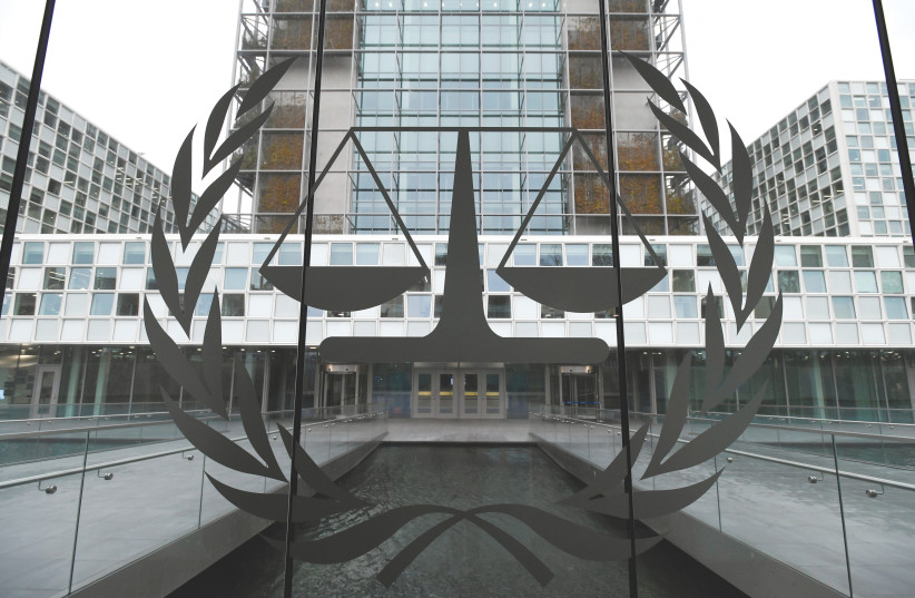 SCALES OF JUSTICE decorate the International Criminal Court building in The Hague, Netherlands, in 2019. (photo credit: PIROSCHKA VAN DE WOUW/REUTERS)