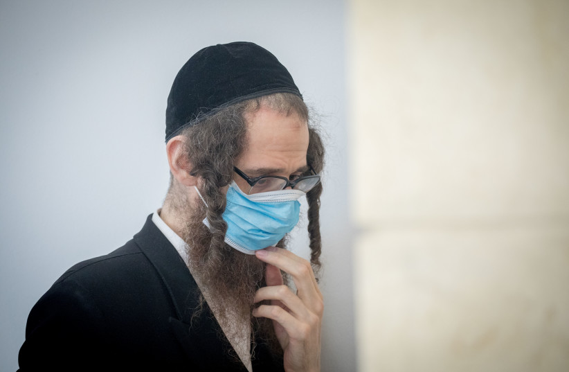 Eliezer Rumpler, from the Lev Tahor Haredi Jewish sect   arrives to the Jerusalem District Court for a court hearing on June 28, 2020.  (credit: YONATAN SINDEL/FLASH 90)