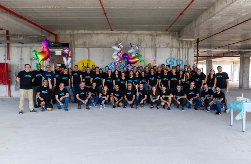 Employees of Next Insurance pose for a photo.  (photo credit: NADAV KARLINSKY)