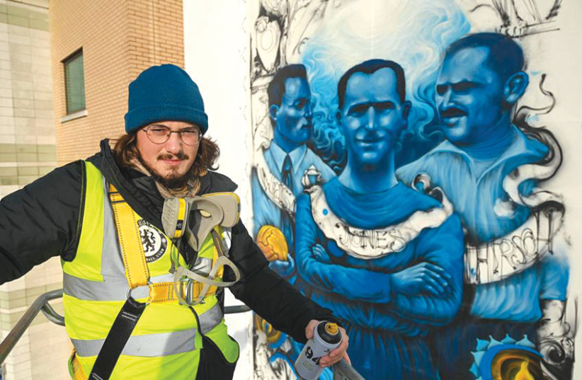 Solomon Souza working on Chelsea’s mural at Stamford Bridge (photo credit: SOLOMON SOUZA)