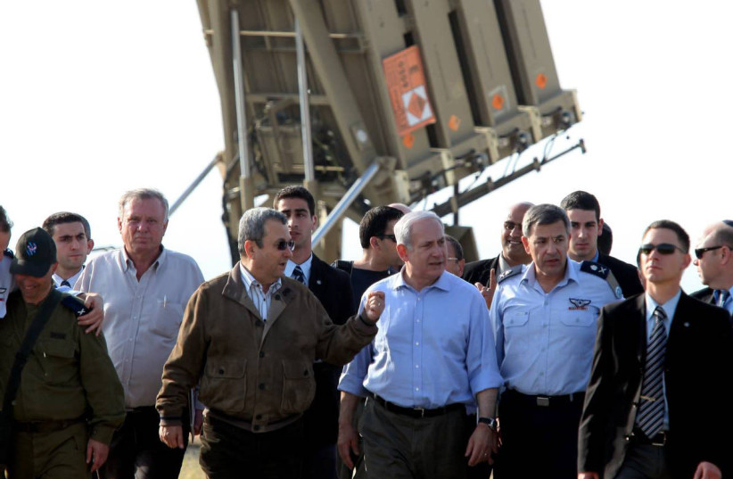 N SYNC: Prime Minister Benjamin Netanyahu and then-defense minister Ehud Barak visit the Iron Dome, deployed in Ashkelon, in April 2011. (credit: EDI ISRAEL/FLASH90)